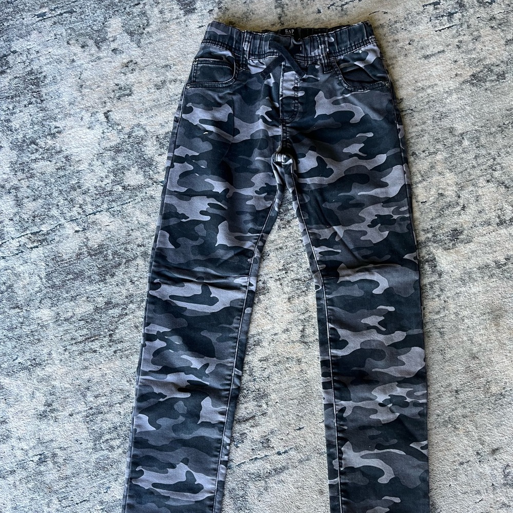 Black & gray camouflage pants.